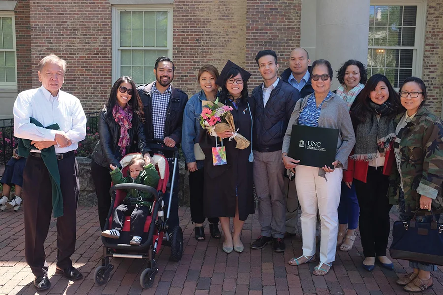 Bernadette Joy is pictured with loved ones after receiving her MBA from UNC Chapel Hill in 2016.