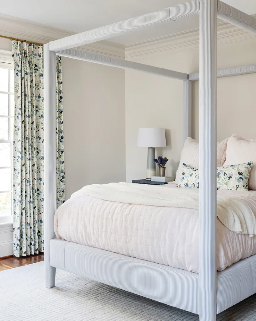 An upholstered four-poster bed by Serena & Lily provides charming comfort in a daughter’s room. Drapery and lumbar pillow fabric by Rebecca Atwood.