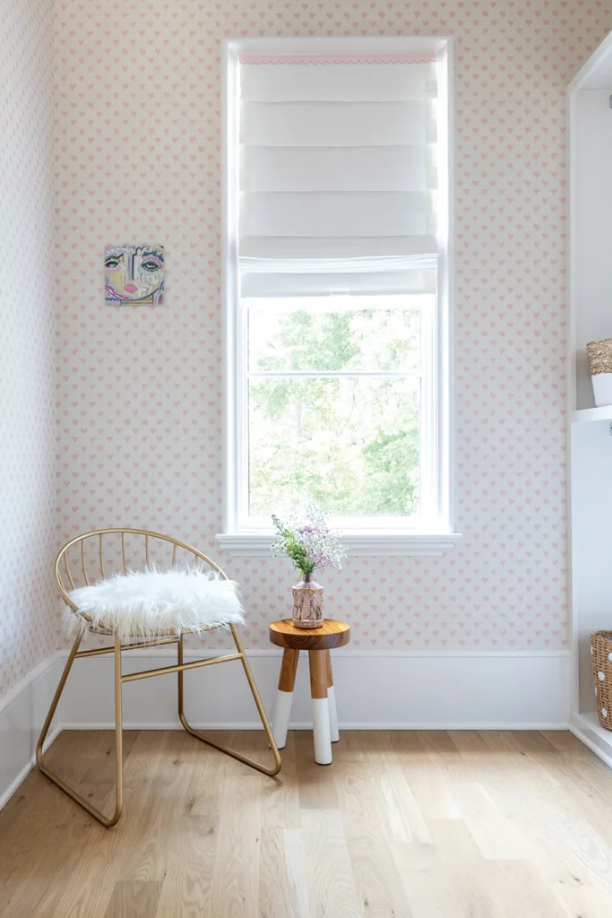 In the closet, a heart-print wallpaper by Schumacher with art by Windy O’Connor