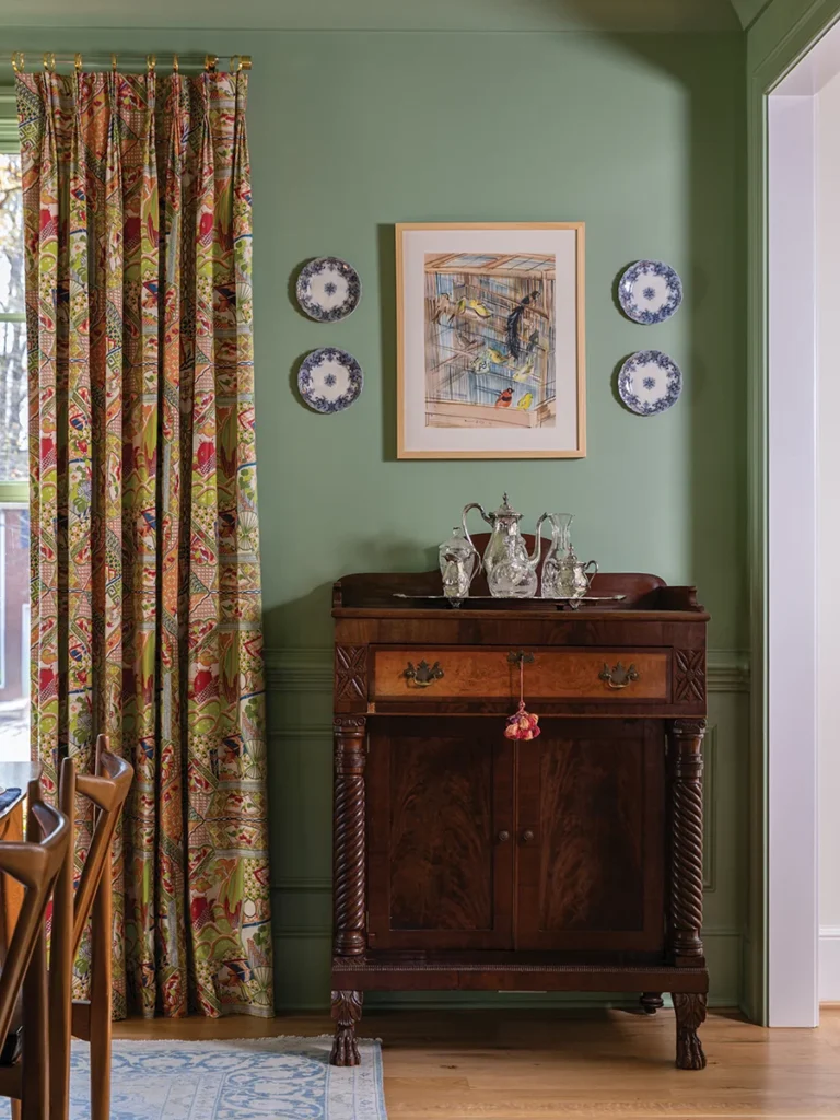Stephanie bought the dining-room curtains at a local estate sale. The antique wooden server belonged to a dear friend, and Stephanie purchased it at her estate auction.