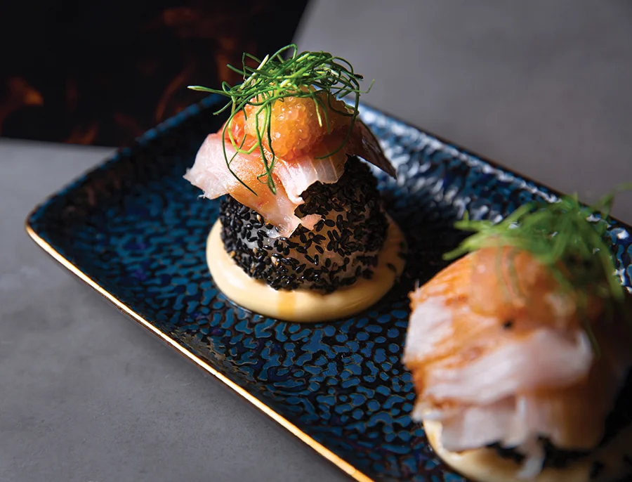 Hamachi with a smoked shoyu glaze over black sesame sticky rice