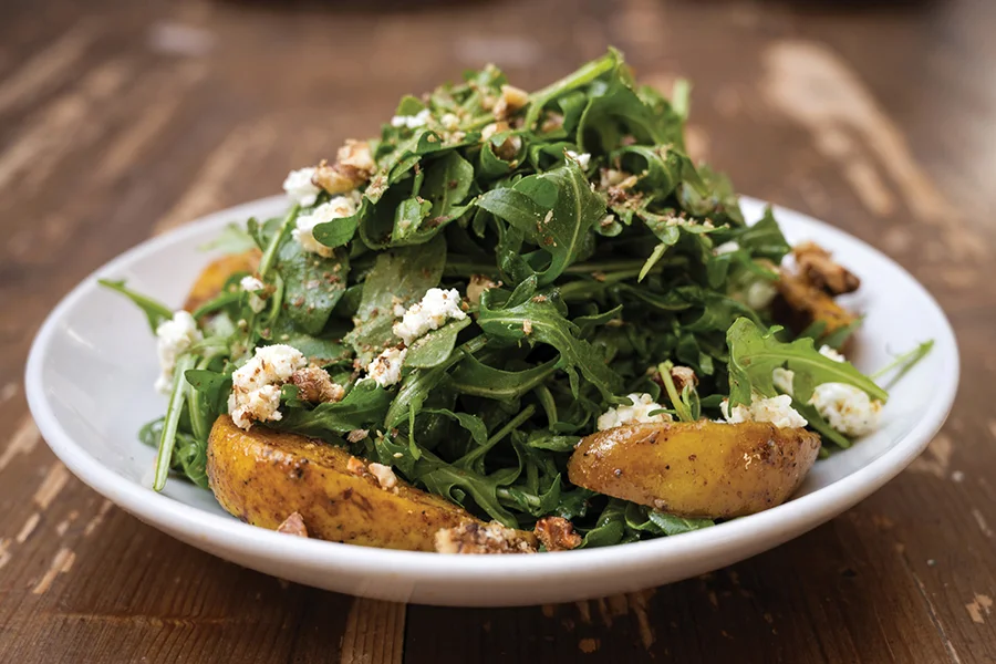 Arugula salad with spiced pear, toasted walnut, chevre and walnut vinaigrette.