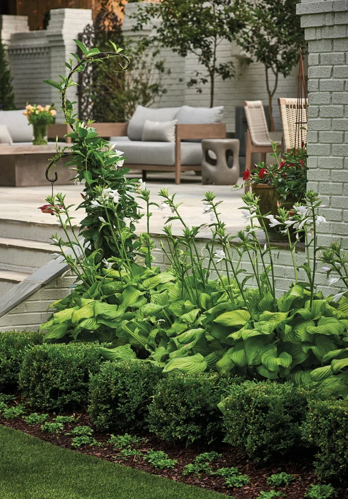 Flowers in front of patio designed by Erin Peiffer