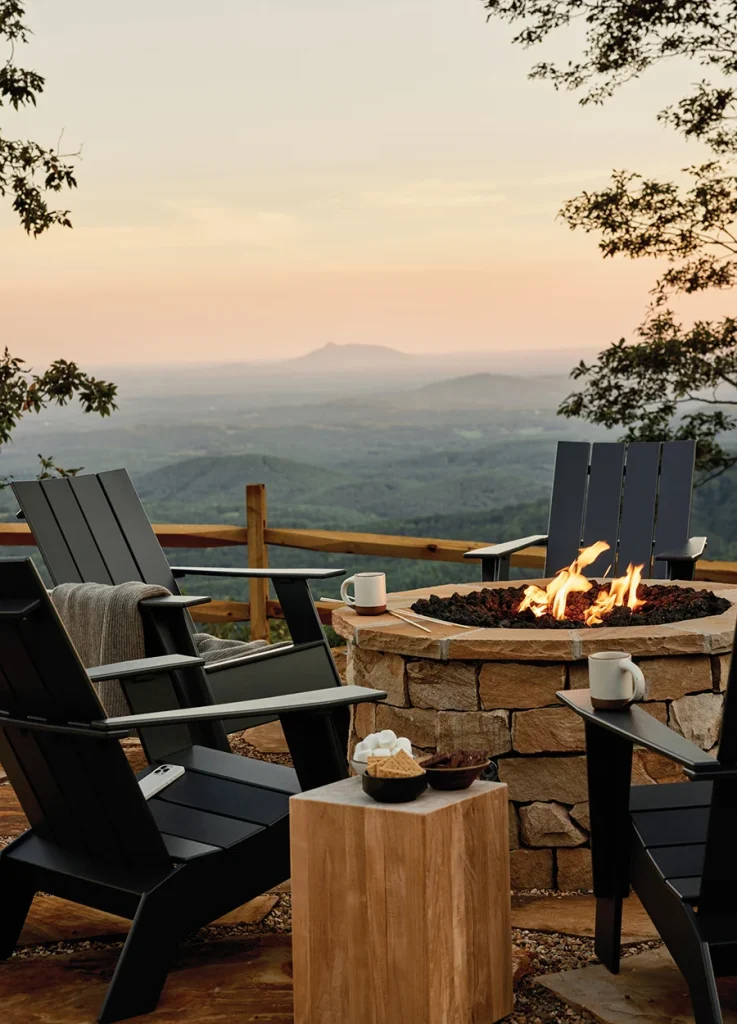 Outdoor fire with s'more makings with mountains in the background at Primland