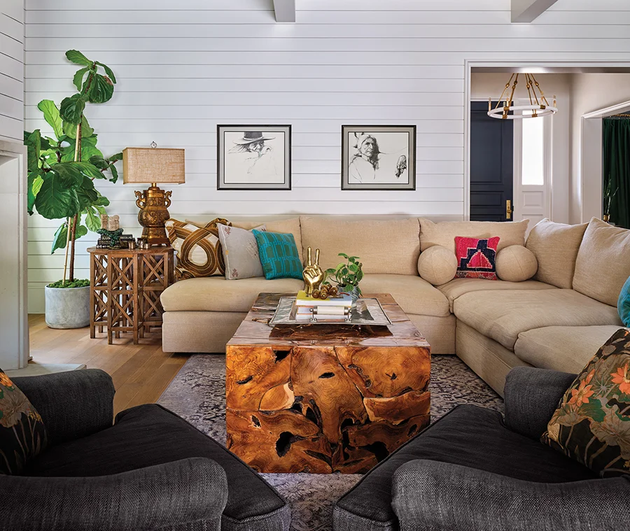 In the living room, two charcoal sketches of indigenous people by Peruvian-born artist Guillermo Acevedo previously belonged to Annie’s grandparents.
