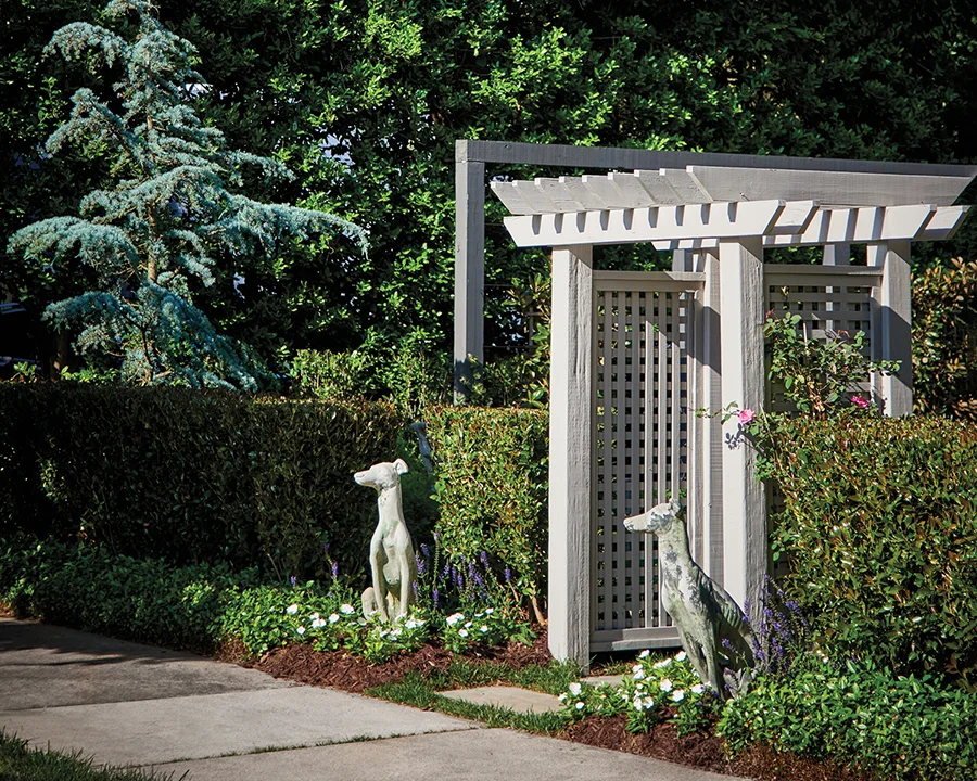 A pair of dog statues, named Teddy and June after Ligon’s dogs, greet visitors at the front garden gate.