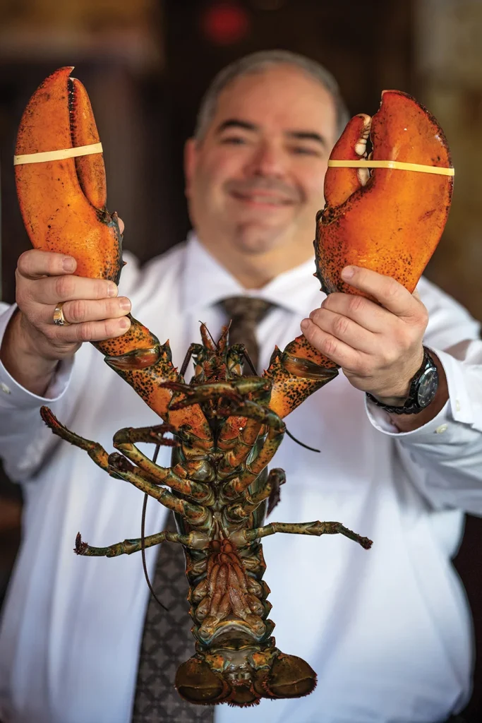 Joey Profeta holding up a lobster