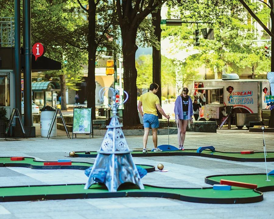 People playing mini golf at Charlotte SHOUT!, photo by Matt Chandler