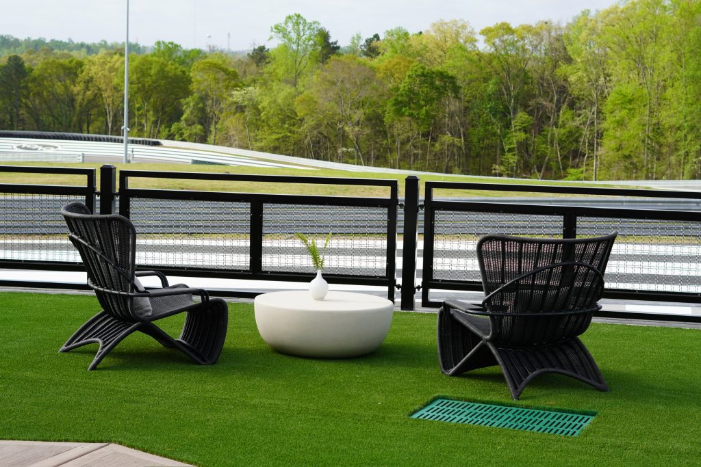 Lounge chairs overlook the circuit at Ten Tenths Motor Club. Photo by Ashley Stroehlein.