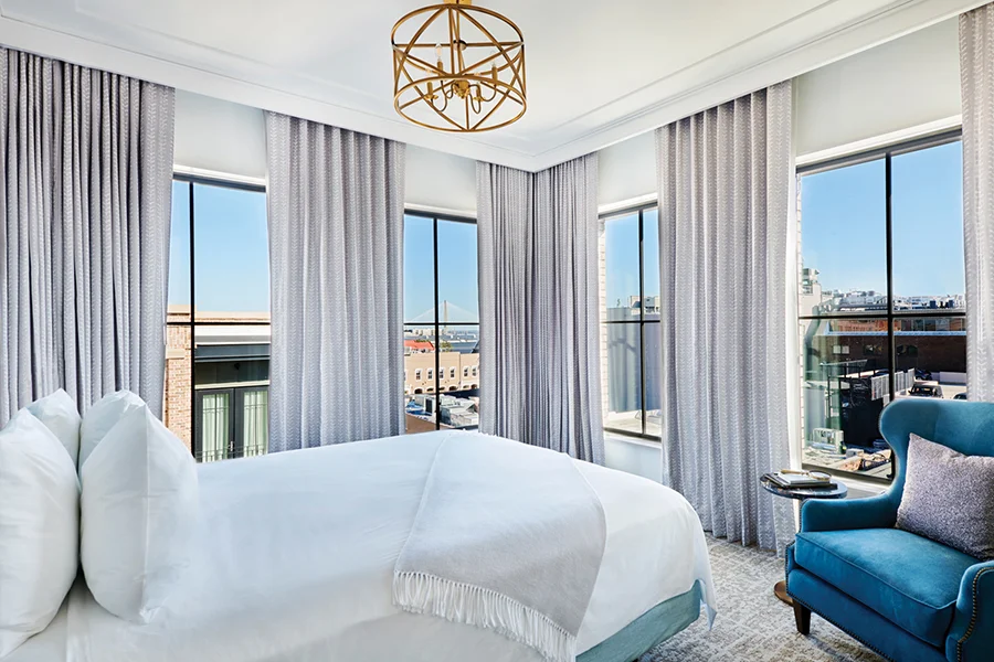 King bed in The Loutrel Hotel in Charleston