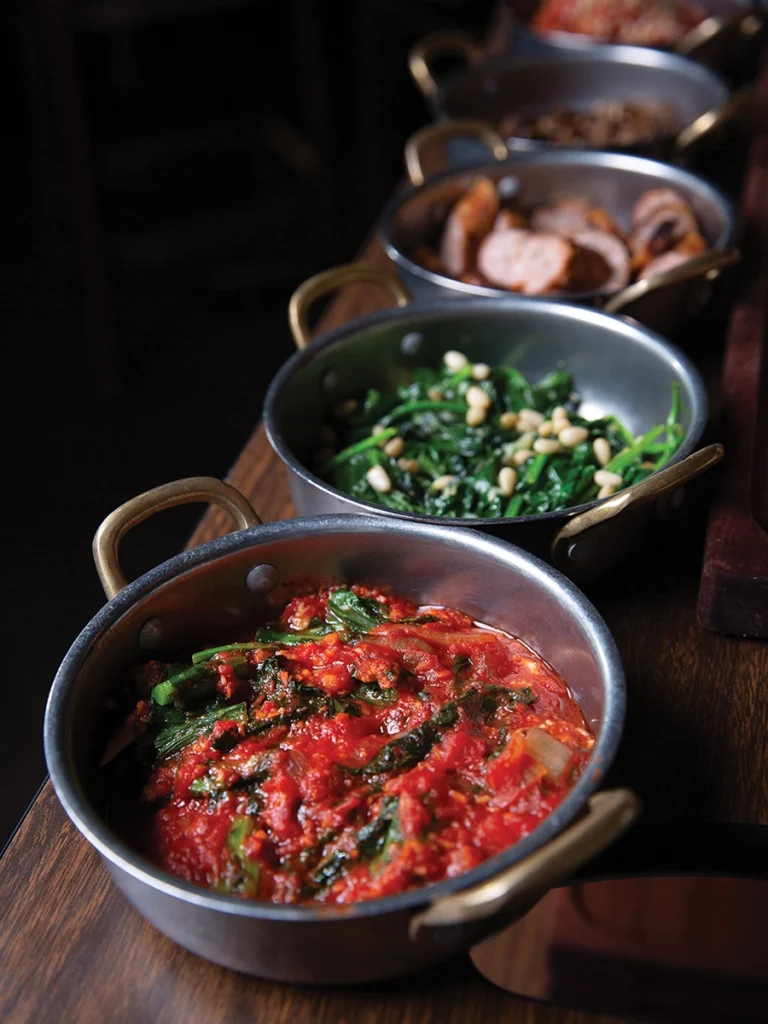 Tableside polenta pour at Fontana Di Vino