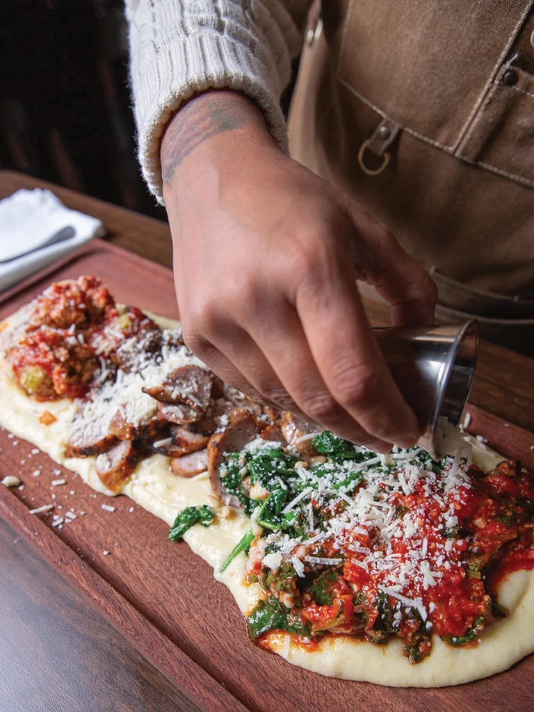 Tableside polenta pour at Fontana Di Vino