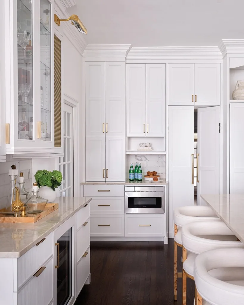 A scullery is concealed behind double doors that look like cabinets.