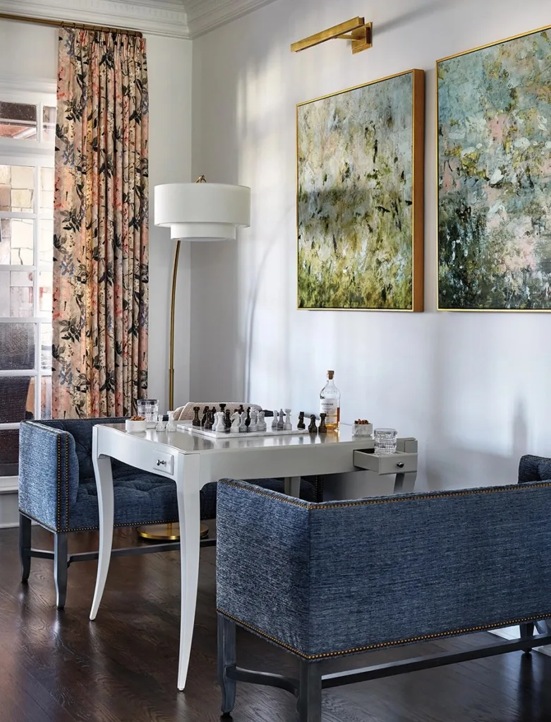 White turned a dark, rarely used living room into a bright, comfortable space with a game table and a sectional sofa for lounging or watching TV.