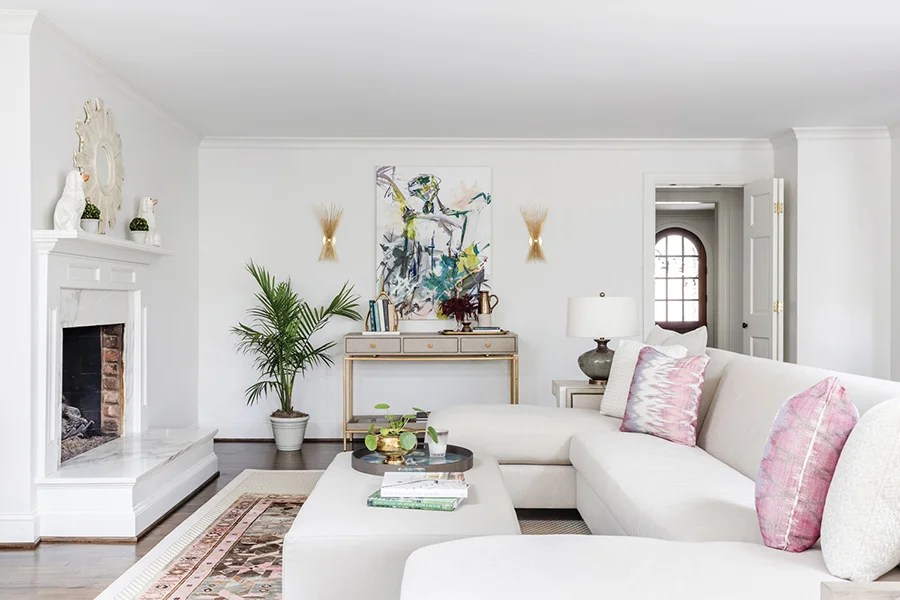 In the family room, a painting by Lauren Reddick from Art House Charlotte provides a focal point for the long, narrow space.