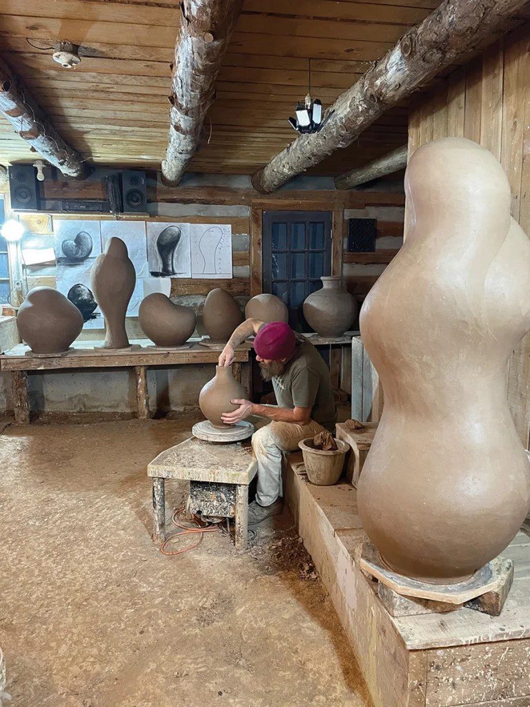 Artist Daniel Johnston sculpting