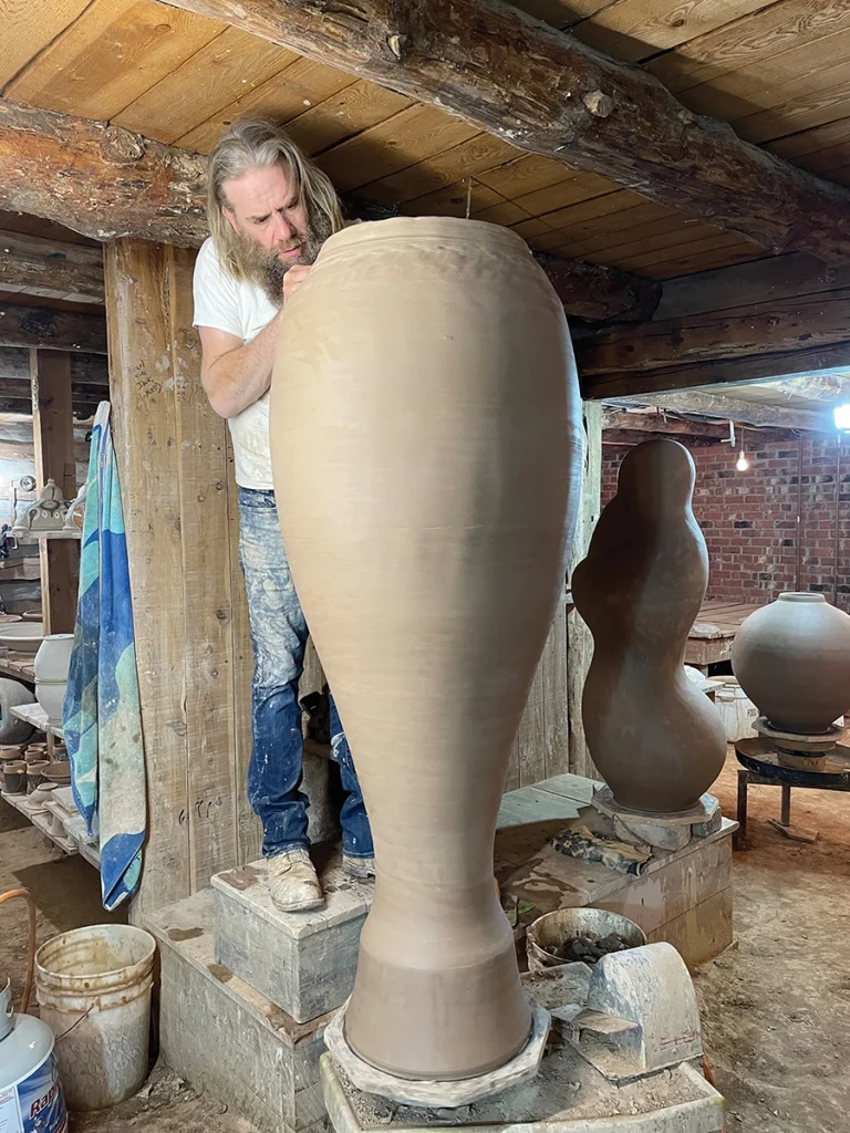 Artist Daniel Johnston sculpting